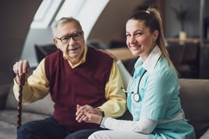 nurse-home-caregiver-is-assisting-old-man-his-home-professional-health-support